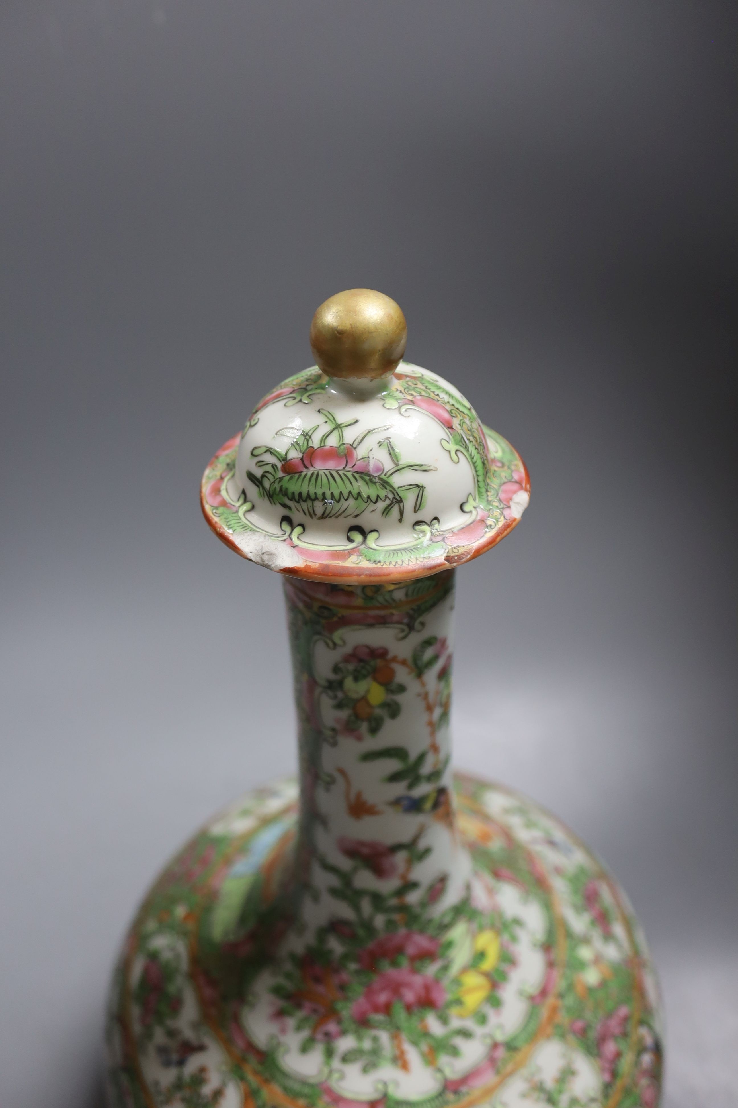 A 19th century Chinese famille rose water bottle with cover and basin, water bottle and cover 39 cms high.